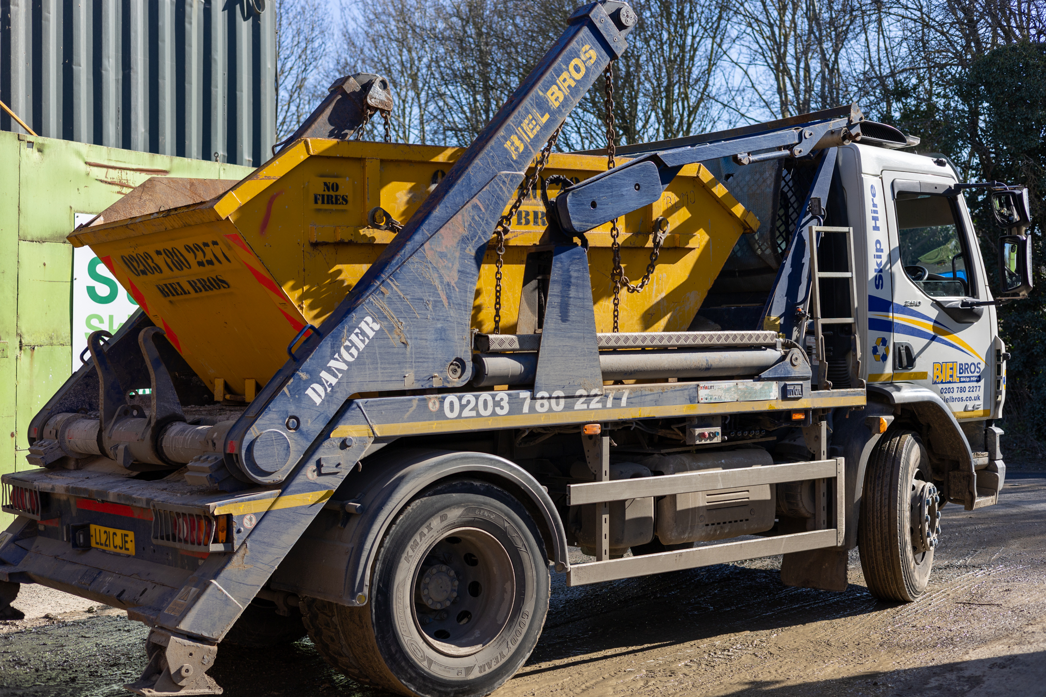 Skip hire being delivered